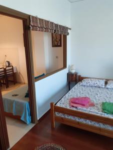 Postel nebo postele na pokoji v ubytování Alex Central City Accommodation