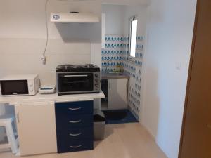 Kuchyň nebo kuchyňský kout v ubytování Alex Central City Accommodation