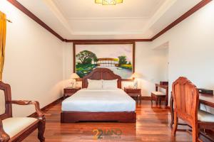 A bed or beds in a room at 22Land Residence Hotel & Spa 36 Hang Trong