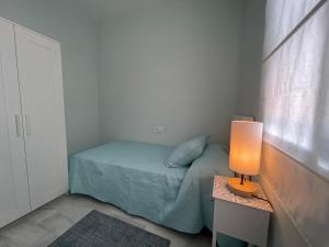 Posteľ alebo postele v izbe v ubytovaní El Sabor del Sur, Apartamentos Living Sur