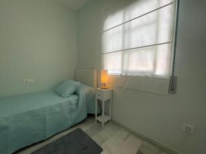 Posteľ alebo postele v izbe v ubytovaní El Sabor del Sur, Apartamentos Living Sur