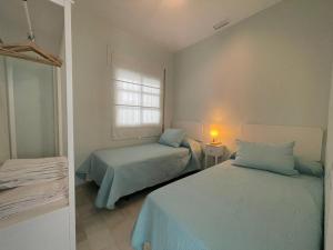 Posteľ alebo postele v izbe v ubytovaní El Sabor del Sur, Apartamentos Living Sur