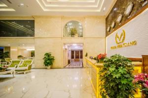 a lobby of a hotel with a sign on the wall at Putin Hotel Nha Trang in Nha Trang