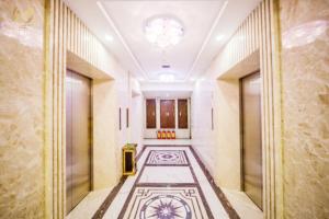 a hallway of a building with a tile floor at Putin Hotel Nha Trang in Nha Trang