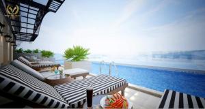 a patio with a view of a swimming pool at Putin Hotel Nha Trang in Nha Trang