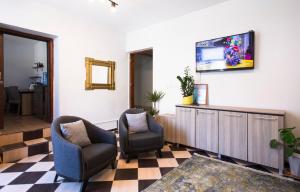 Телевизор и/или развлекательный центр в Homelike Guest house