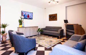 Телевизор и/или развлекательный центр в Homelike Guest house