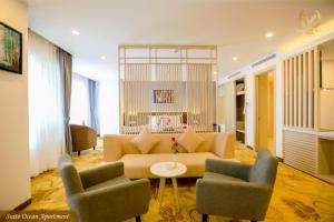 a living room with a couch and two chairs at Putin Hotel Nha Trang in Nha Trang
