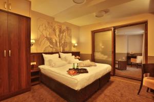 
Кровать или кровати в номере Hotel Amber Design
