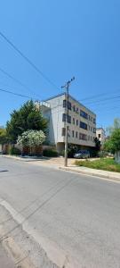 an empty street in front of a building at Villa Madani in Durrës