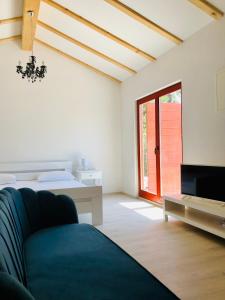 a living room with a couch and a tv at Villa Marija in Vrsar