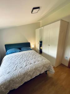 מיטה או מיטות בחדר ב-Apartment Camellia