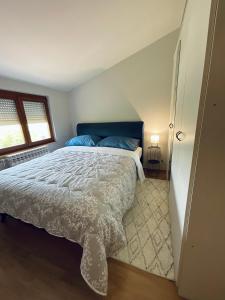 מיטה או מיטות בחדר ב-Apartment Camellia