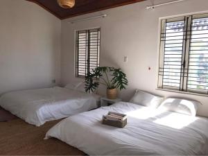 Кровать или кровати в номере Lespoir home