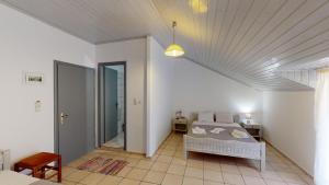 Posteľ alebo postele v izbe v ubytovaní Hotel Akropolis
