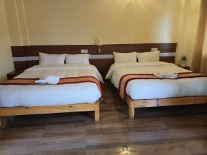 Postelja oz. postelje v sobi nastanitve HOTEL LUMA INN