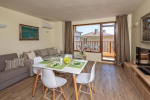 a living room with a table and chairs and a couch at Къща Катерков in Sozopol