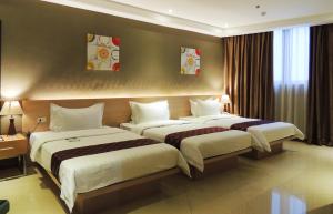 Postel nebo postele na pokoji v ubytování Dela Chambre Hotel