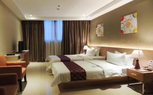 Postel nebo postele na pokoji v ubytování Dela Chambre Hotel