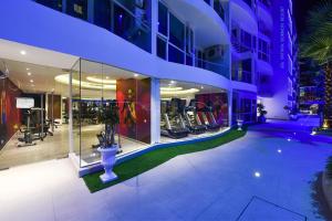 a view of a building with a gym at Grand Avenue Condo by Bormon in Pattaya Central