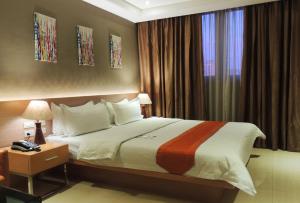 Postel nebo postele na pokoji v ubytování Dela Chambre Hotel