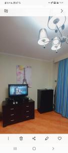 a living room with a flat screen tv and a tv stand at Porto marina luxury flat for families onlyشاليه فاخرداخل بورتو مارينا in El Alamein