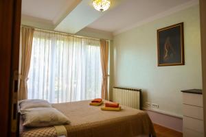 Postel nebo postele na pokoji v ubytování Apartments Okuka