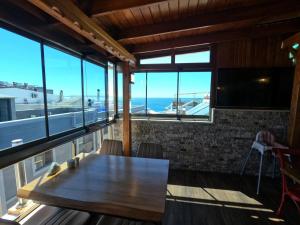 a table in a room with a view of the ocean at Alâ Avsa Hotel in Avşa Adası