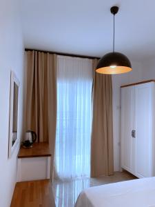 A bed or beds in a room at Amber Boutique Hotel