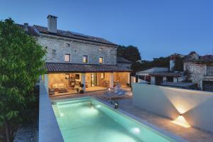 a swimming pool in the backyard of a house at Casa Evina in Krnica