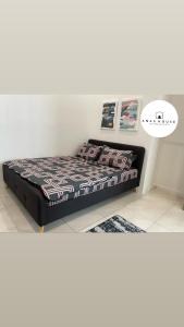 a bedroom with a bed in a room at Anas House in Tanjung Rambutan +11 photos