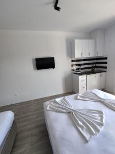 Postel nebo postele na pokoji v ubytování Horizont Dobre Vode