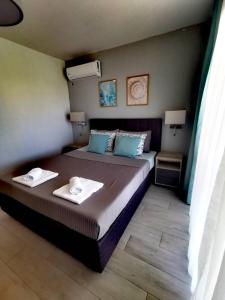 Postel nebo postele na pokoji v ubytování Blue Breeze