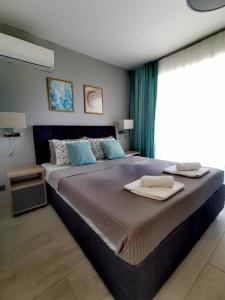 Tempat tidur dalam kamar di Blue Breeze