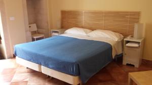 Postel nebo postele na pokoji v ubytování Iblea Paradise
