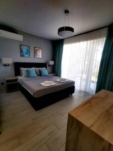 Postel nebo postele na pokoji v ubytování Blue Breeze