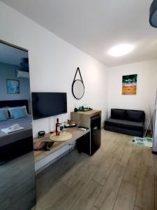 TV a/nebo společenská místnost v ubytování Blue Breeze