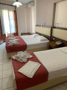 Posteľ alebo postele v izbe v ubytovaní Hotel Eleana