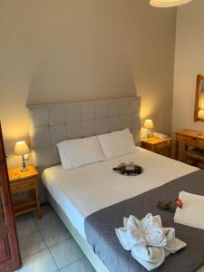 Posteľ alebo postele v izbe v ubytovaní Hotel Eleana