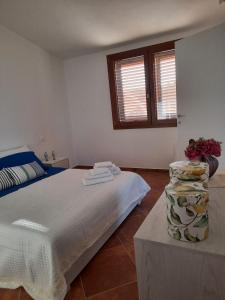 Villa Impetrata IUN Q7090 tesisinde bir odada yatak veya yataklar