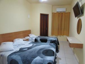 Säng eller sängar i ett rum på Hotel Monteneve