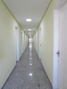 an empty hallway in an office building at Hotel Monteneve in São Paulo