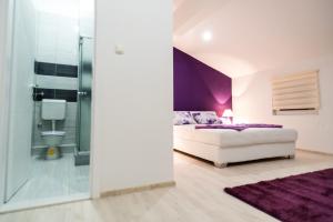 Postelja oz. postelje v sobi nastanitve Purple rooms