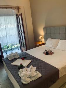 Posteľ alebo postele v izbe v ubytovaní Hotel Eleana
