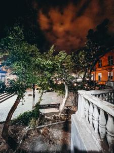 a tree and a bench on a bridge at Apartments Tumanyan in Yerevan