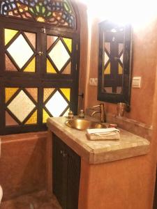 a bathroom with a sink and a window at Riad Kech Soul Boutique & Spa in Marrakesh