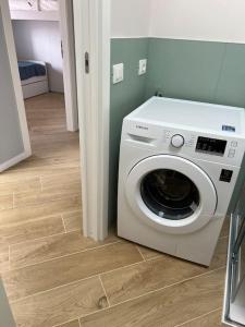 a washer and dryer in a room at Boutique Apartment - Tropea in Tropea