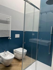 a bathroom with a toilet and a sink at Boutique Apartment - Tropea in Tropea
