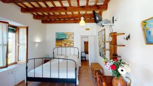 a bedroom with a bed in a room at El Palomar de la Breña in Barbate