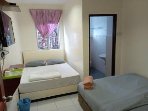 Postel nebo postele na pokoji v ubytování CH Budget Hotel